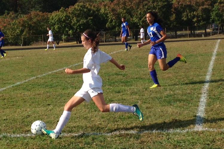 Junior Teresa Smith guides the ball down the field against Wise.