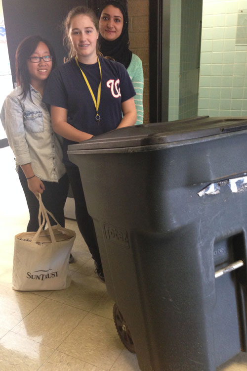 Members of Junior Civitan recycle paper goods.