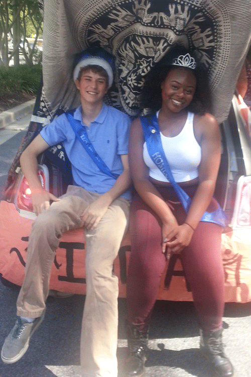 Seniors Jake Ewing and Kechi Akaroio, Homecoming king and queen, posed on their float during Saturdays parade.