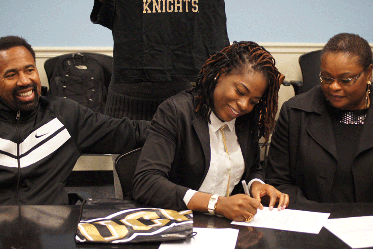 Senior Tolulope Omokore signed with the University of Central Florida this morning in the cafeteria conference room. 