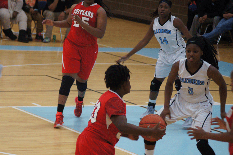 The Dynamic Duo, Kaila Charles and Tolulope Omokore play hard defense against the Rams.