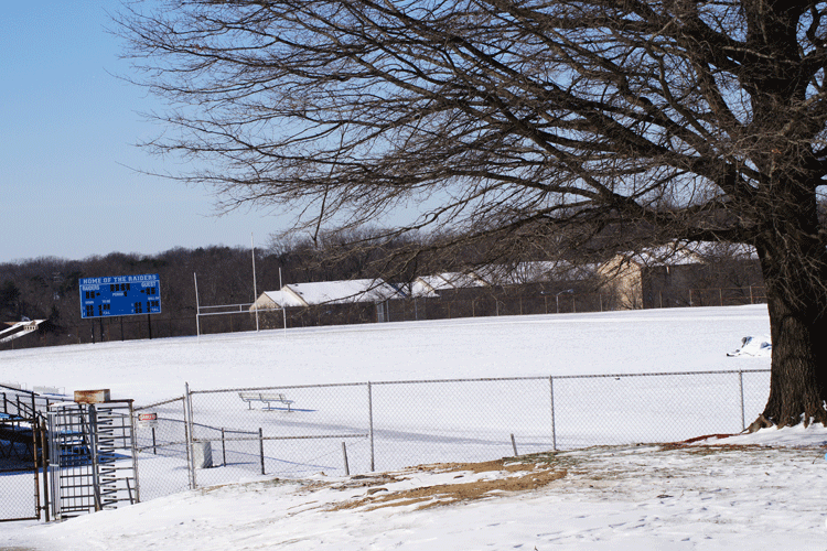 Snow blankets Roosevelts football field.