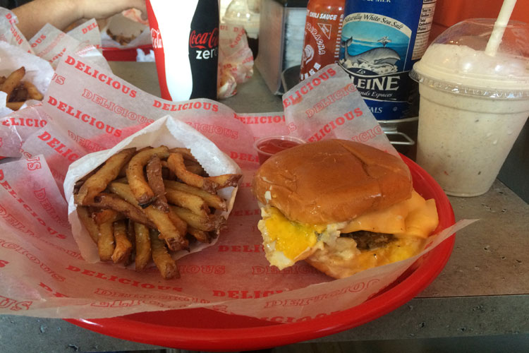 Spikes Sunnyside burger with a side of fries and a toasted marshmallow milkshake. 