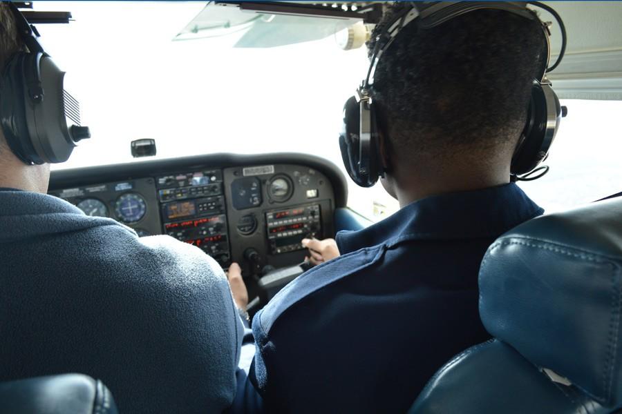 Cadet Bolaji Odupitan at the controls of a Civil Air Patrol Cessna 172 during his orientation flight