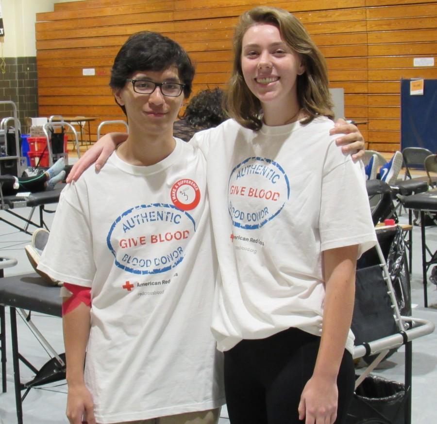 Tony Pham (Left) and Nora Snyder (Right) from the NHS Blood Drive Committee help out.