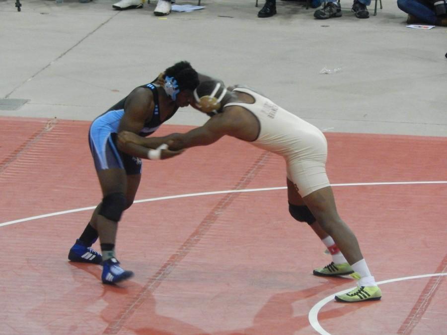Chibueze Onwuka (Left) battles for position in his state championship match.