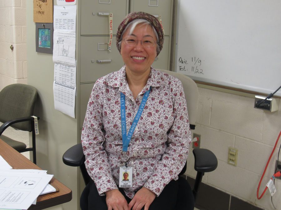 Eleanor Roosevelt Physics Teacher, Ms. Yau-Jong Twu, sitting comfortably at her desk.