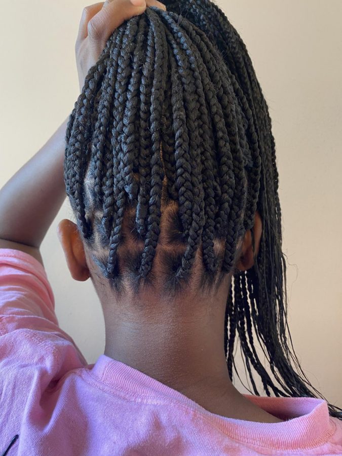 Junior Kendal Howell’s client displays her parted medium-sized box braids and dipped ends. Photo courtesy of Kendal Howell