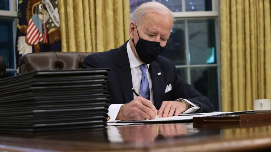46th President of the United States Joseph R. Biden signs executive orders on his first day in office