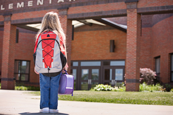 A student arriving at school. Photo courtesy of sheknows.com 