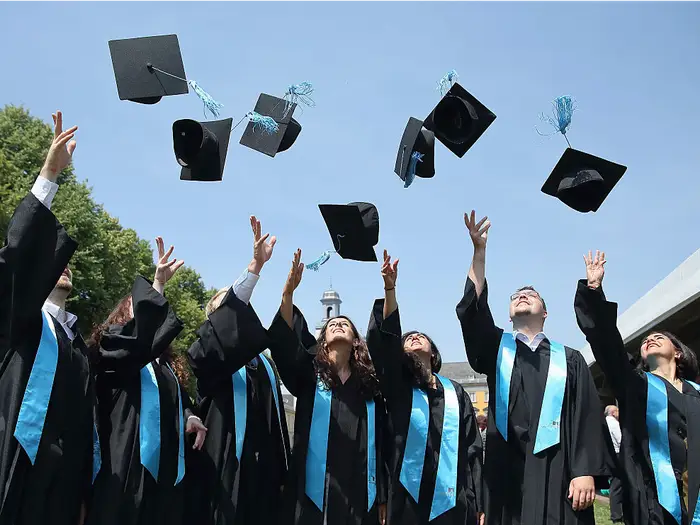 Photo of high school graduates, courtesy of Andreas Rentz from Getty Images.