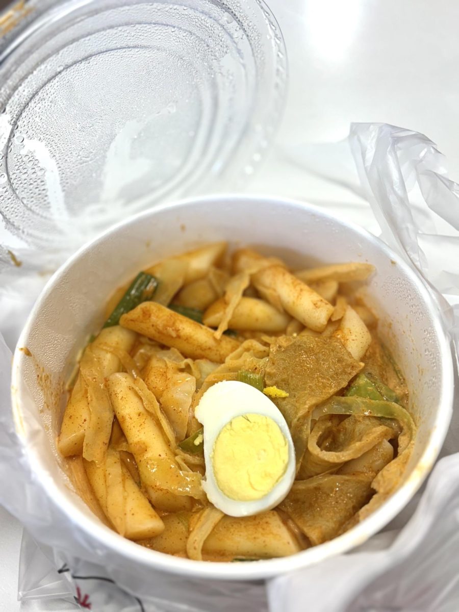 Rose tteokbokki with rice cakes, fish cakes, and egg from Bb.q Chicken