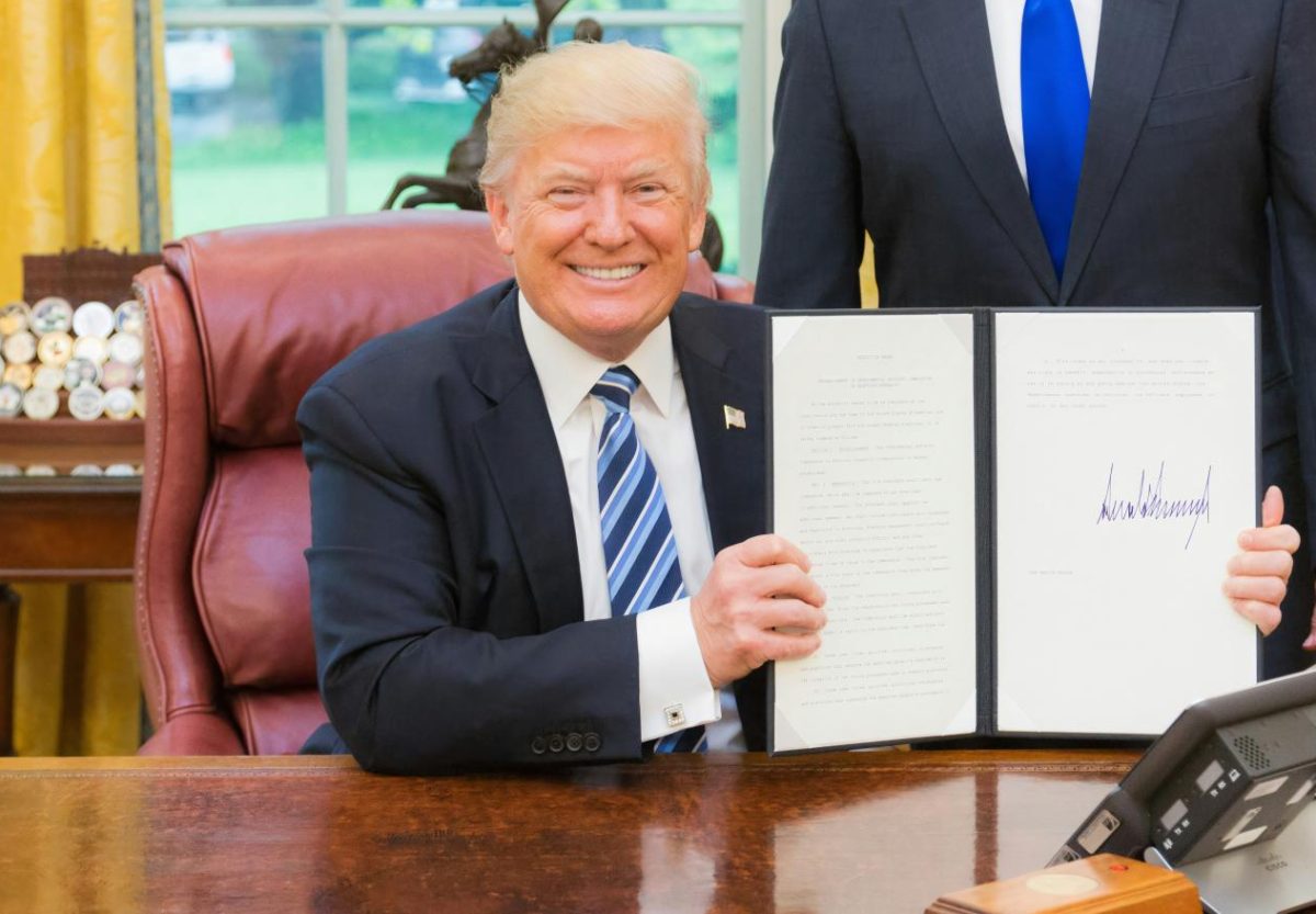 President Trump with an Executive Order