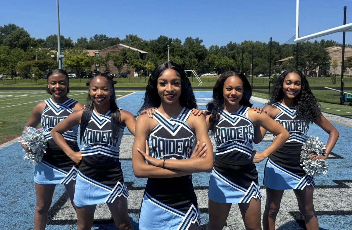ERHS cheerleaders on media day with Milan Wilson 