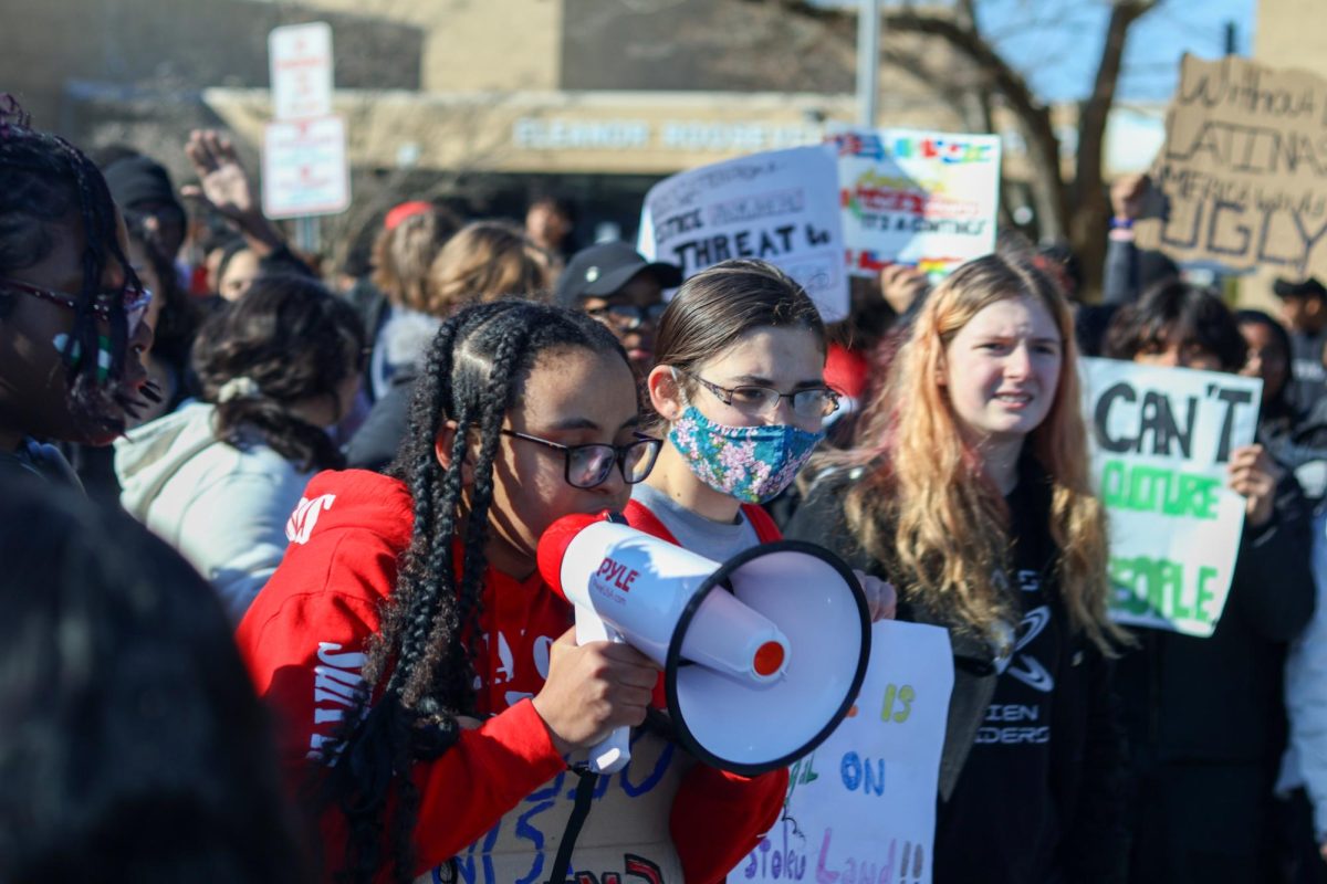 Kasiye Woubeshet, co-leader of Students Against ICE, holds the megaphone. Picture taken by student photographers.