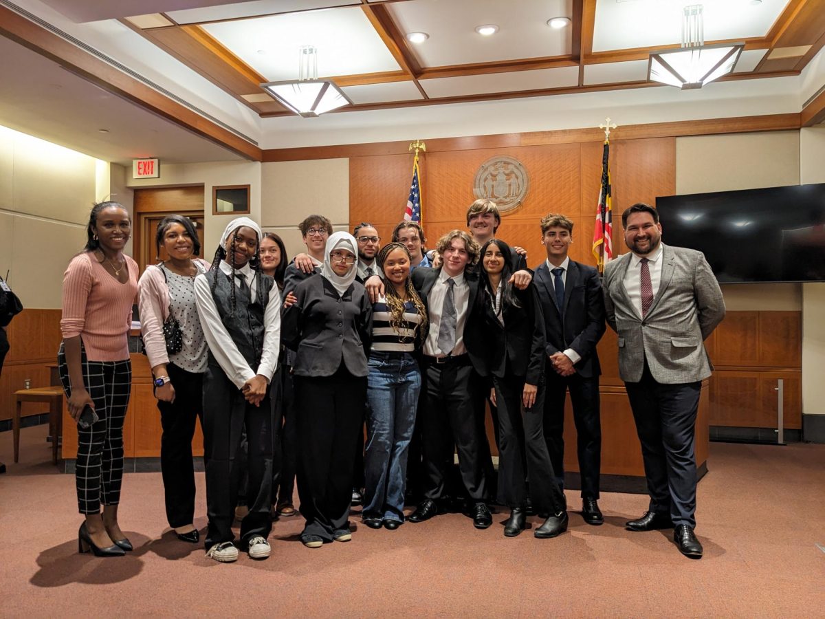 Photo of Mock Trial Team (From Left to Right):  Jasmine Berry, Lauren London, Magali Ngumesone, Erica Ortizlucero, Samuel Tucker, Tuqa Alyasiri, Danzson Celdran-Taylor, Stone Purvis, Caiden Krempel, Gavin Lansing, Joseph Ruby, Ishika Saha, Alexander Reese, Alexander Miletich