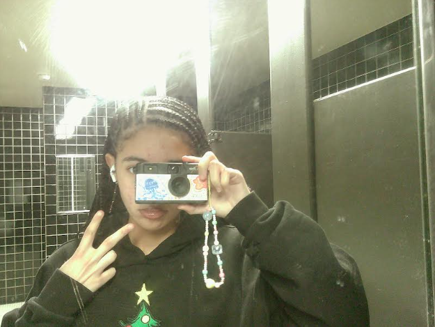 Junior Miracle Davis uses a digital camera to give her photos that retro feel