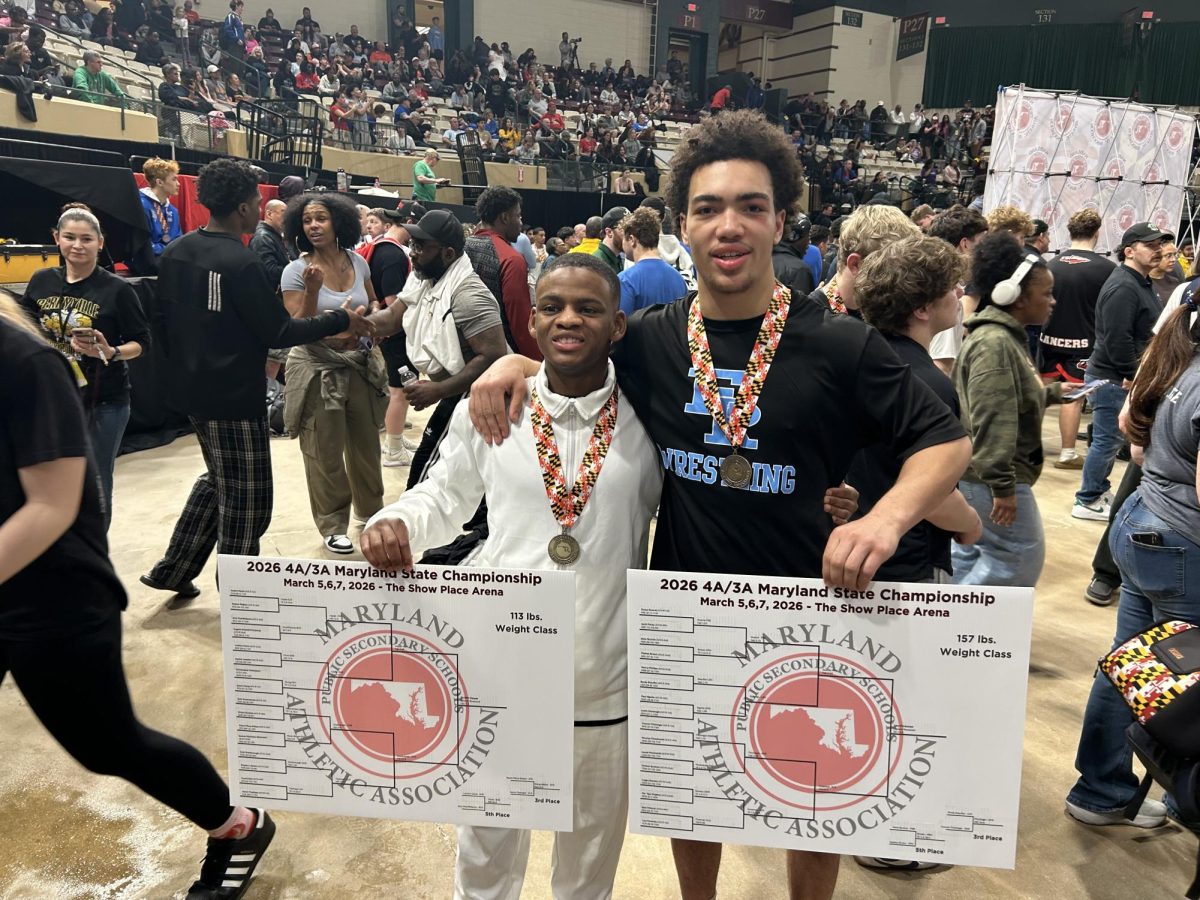 Hayes and Foreman celebrate with their States medals 